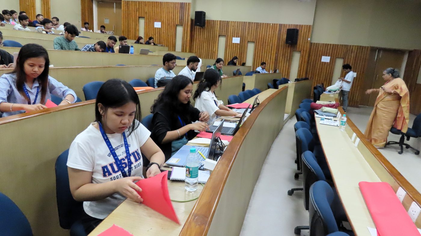 Participants working in the lecture hall during Day 4